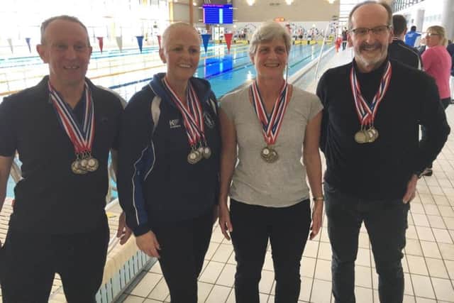Hemel Hempstead Swimming Club medal winners poolside at the Norfolk Masters Long Course Open held at Norwich University earlier this month.