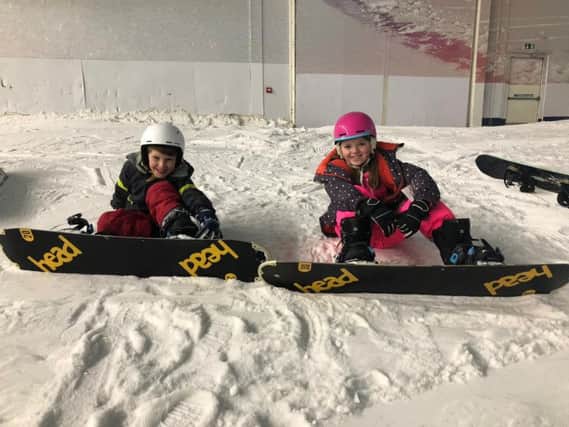 Luca Aspart and Iris McCarthy during their free birthday snowboard lesson at The Snow Centre in Hemel Hempstead recently.
