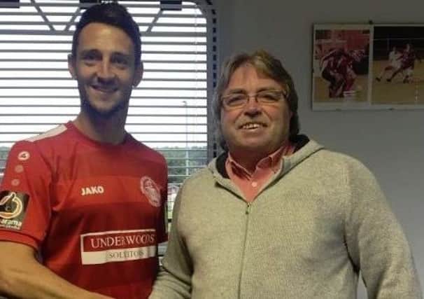 Tudors new signing Luke Howell with chairman Dave Boggins.