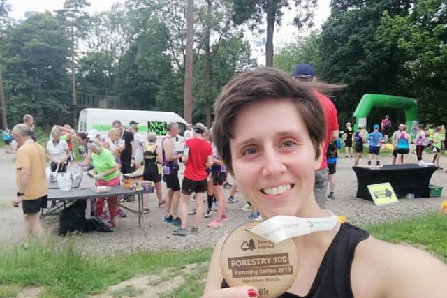 Gade Valley Harriers member Rossiana Mee with her medal after completing the Wendover Woods 10k event over the weekend.