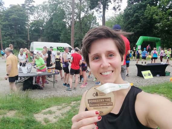 Gade Valley Harriers member Rossiana Mee with her medal after completing the Wendover Woods 10k event over the weekend.