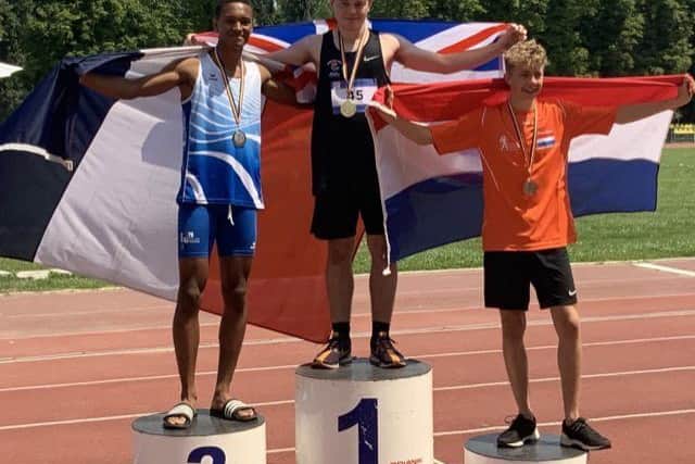 Ralph Williams on top of the podium with his gold medal in Romania.