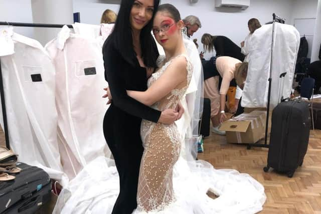 April Banbury pictured with one of her models at London Fashion Week