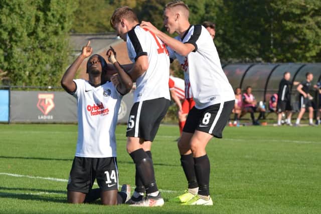 Matty Campbell-Mhlope, left, celebrates with his Kings Langley team-mates after netting their third goal in Saturdays 4-0 FA Cup triumph over Folkestone. (Picture by Chris Riddell).