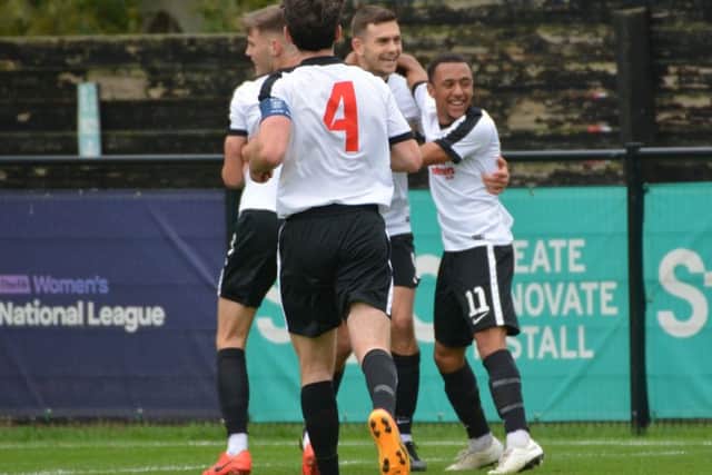 Kings Langley players celebrate en route to their historic FA Cup success on Saturday against Corinthian Casuals. (Picture by Chris Riddell).