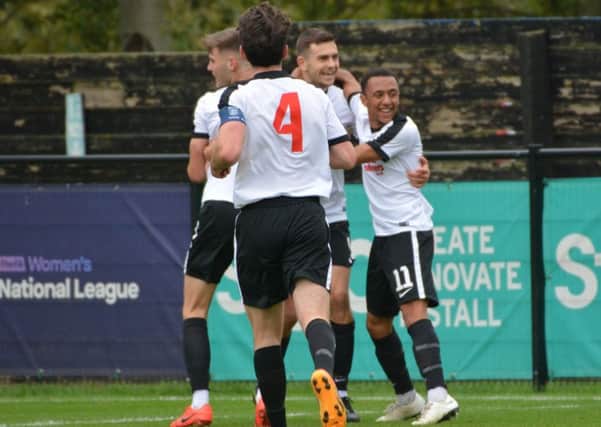 Kings Langley players celebrate en route to their historic FA Cup success on Saturday against Corinthian Casuals. (Picture by Chris Riddell).