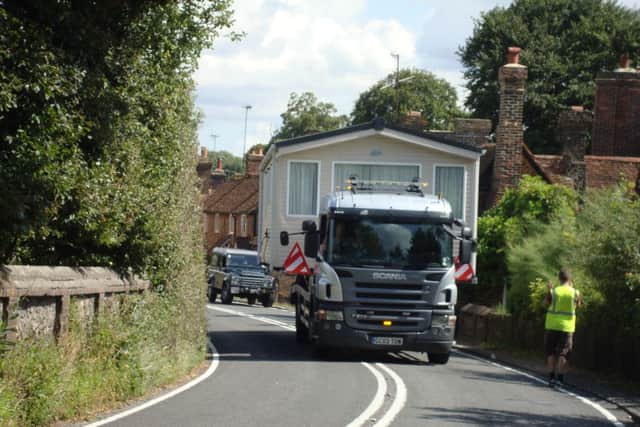 A house was transported through the narrow road of Water End
