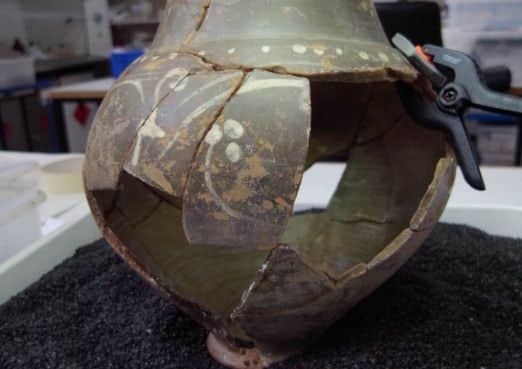 Cow Roast Pottery  is now on display at Hemel Hempstead's Civic Centre. Pictured during conservation work.  PNL-140820-164807001