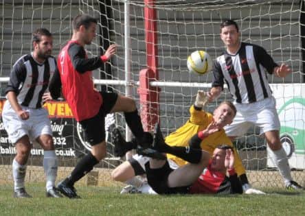 Taylor Collins and Stewart King battle for the ball against Hadley. Picture (c) Colin Sturges PNL-140824-180053002