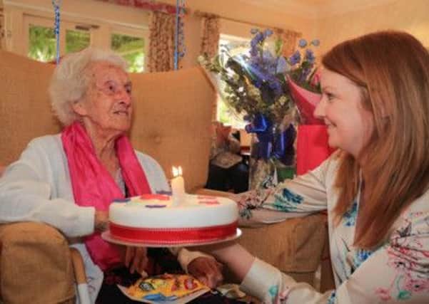 Betty Barney celebrates her 103rd birthday, pictured here with care home manager Diane Delicate and, below, with her son Terry Neal