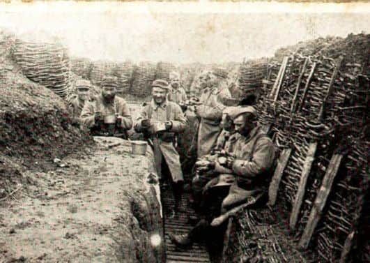 Midday meal in a Great War trench (above), a Loos memorial to the soldiers who died in the conflict (below) and Walter Young (bottom)