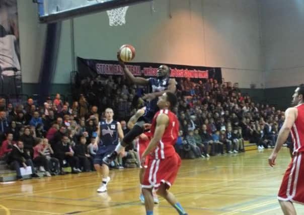 Storm's Bode Adeluola driving to basket