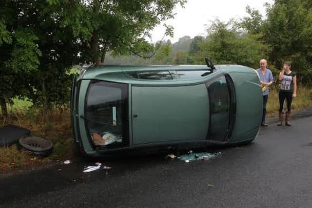 Adrian Johnson wants to thank the passers-by who helped him when his car flipped over on Saturday morning