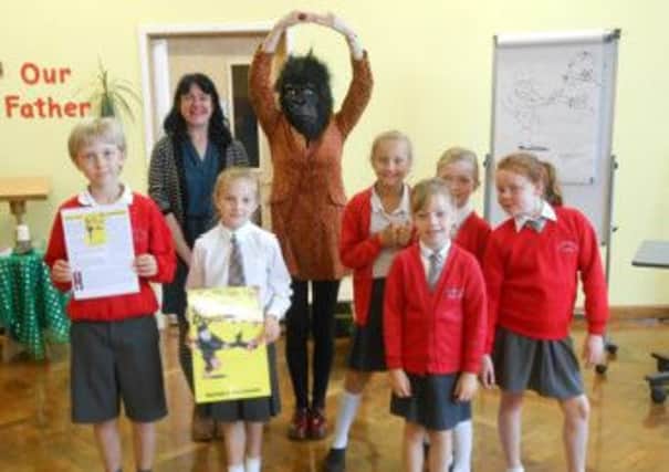 Mary Casserley and Sue Hampton (with gorilla head) at St Thomas More Catholic Primary School, Berkhamsted