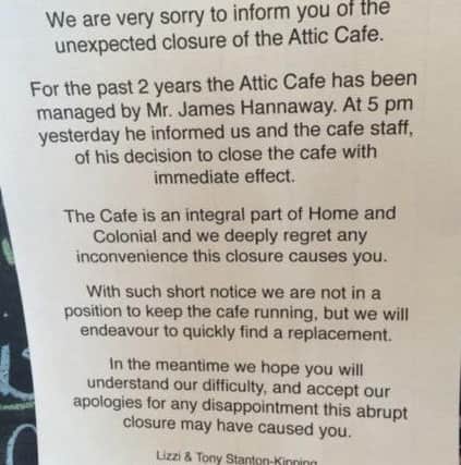 Sign announcing the closure of the Attic Cafe PNL-140110-132422001