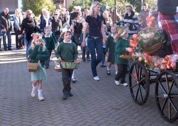15/10/11The Tring Apple Fayre started with a procession at the Kings Head which went down Tring High Street to the Farmers Market. Children from St Bartholomews  School were also apart of the procession following close behind Mayor Allan. Elizabeth Newey and Sebastian Mcintosh. ENGPNL00120111018092434
