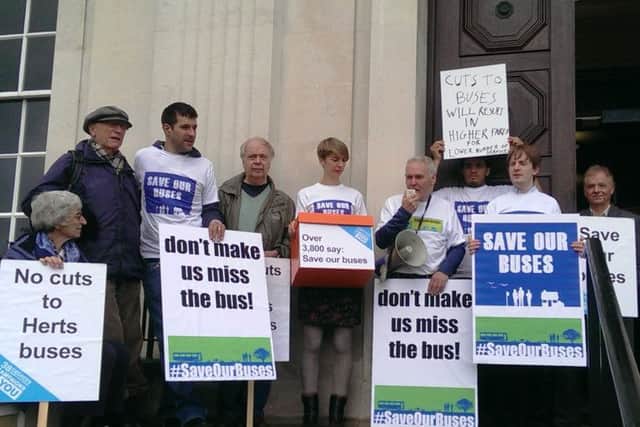Protest against bus cuts outside County Hall