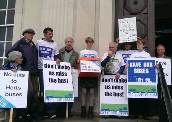 Protest against bus cuts outside County Hall