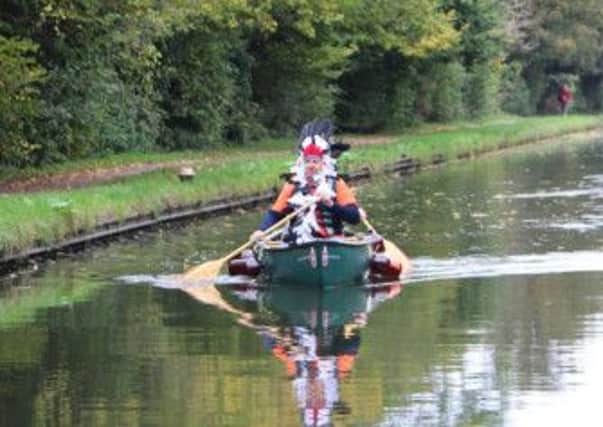 Nigel Oseland paddles down the Grand Union Canal