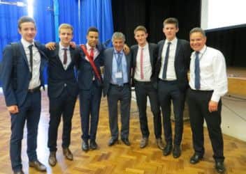 David Dein is pictured with Hemel Hempstead School sixth-form students and a member of staff PNL-141017-142033001