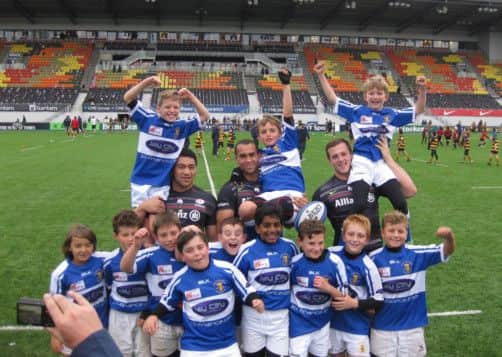 The Camelot U11 players celebrated their continued winning streak with several of the Saracens Academy players