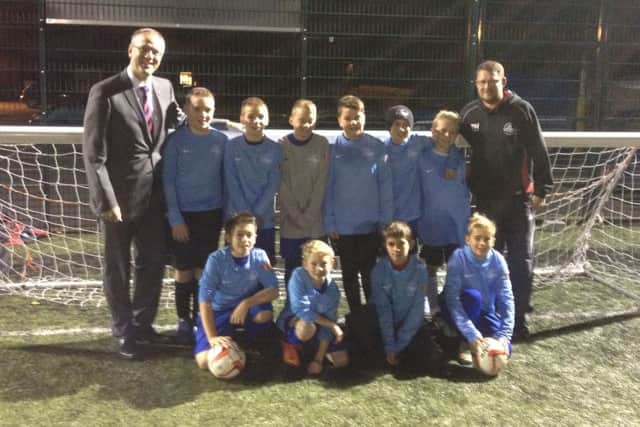 The Hemel Hempstead Youth U12s receive their new kit from McDonalds franchisee Alan Butchers