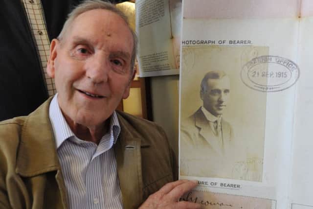 Hemel Hemel Hempstead Quaker Peter Yeoman with a passport photograph of his father Gilbert Yeoman at the Friends' First World War exhibition