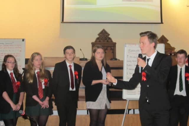 Youngsters stage an election as part of an event to celebrate local democracy