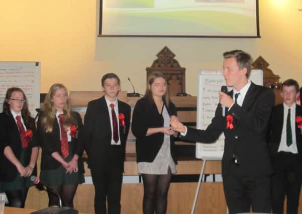 Youngsters stage an election as part of an event to celebrate local democracy