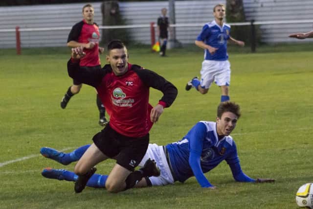 Stewart King was brought down in the area to win a penalty for Tring's fourth goal. Picture (c) Marc Keinch
