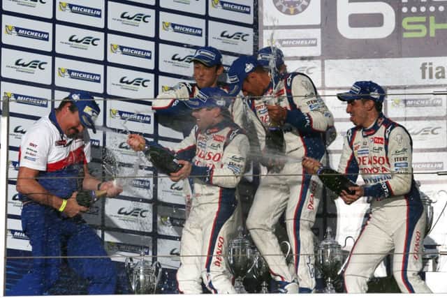 Toyota Hybrid Racing celebrate their victory in Shanghai, China. Picture (c) James Moy Photography