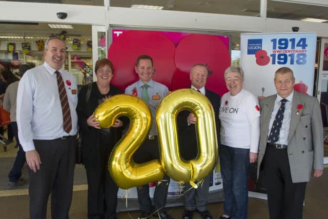 Sue Rose and staff at the Sainsburys Apsley store mark the supermarket's 20th year supporting The Royal British Legion. Photo: Caters Photographic PNL-140411-120523001