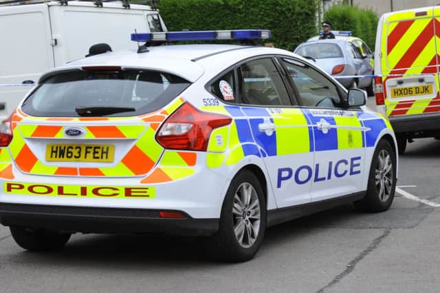 Police at the scene of one of the attacks on women in Cosham