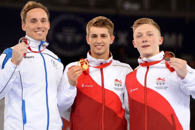 Max Whitlock (centre) on the podium with Dan Keatings and Nile Wilson at the Commonwealth Games in Glasgow. Picture (c) PA Wire/Press Association Images