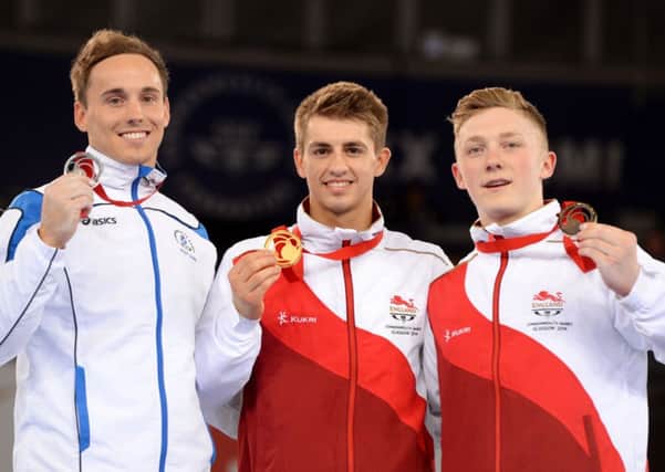 Max Whitlock (centre) on the podium with Dan Keatings and Nile Wilson at the Commonwealth Games in Glasgow. Picture (c) PA Wire/Press Association Images