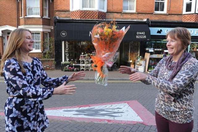 Beverley Hartman, right, hands over her Magnolia Flowers business to new proprietor Helen Mitchell in Tring