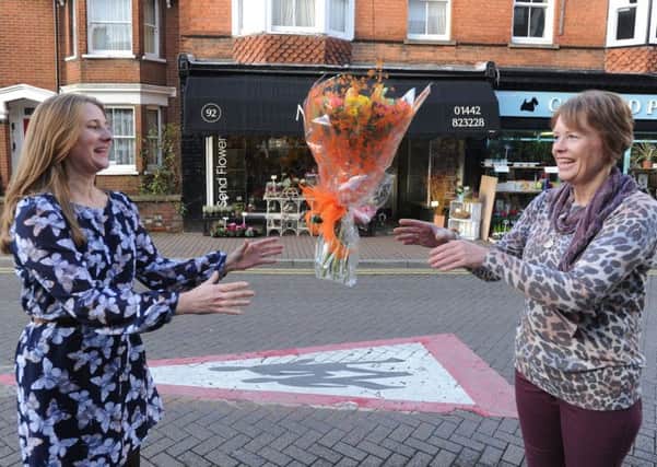 Beverley Hartman, right, hands over her Magnolia Flowers business to new proprietor Helen Mitchell in Tring