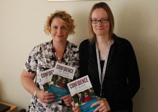 Jacqui Sheppard from Home Instead with librarian Emma Scott
