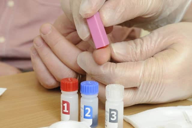 HIV TESTING (PM) MRW 17/3/2014
A new HIV test for Hampshire - Scott Deacon (47) has an HIV test done by Andrew Smith (37) - an HIV Prevention Lead for Solent NHS Trust
Picture: Malcolm Wells (14796-5406) PPP-140317-175723001