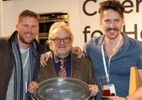 Celebrity chef Antony Worrall Thompson presents the award to Brandon Kirby and Mark Snelling of The Alford Arms
