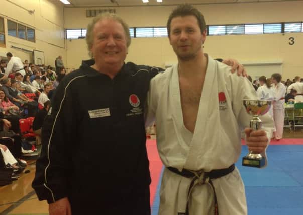 Malcolm Phipps congratulates Adam Cockfield on his victory at the Portsmouth Open Karate Championships