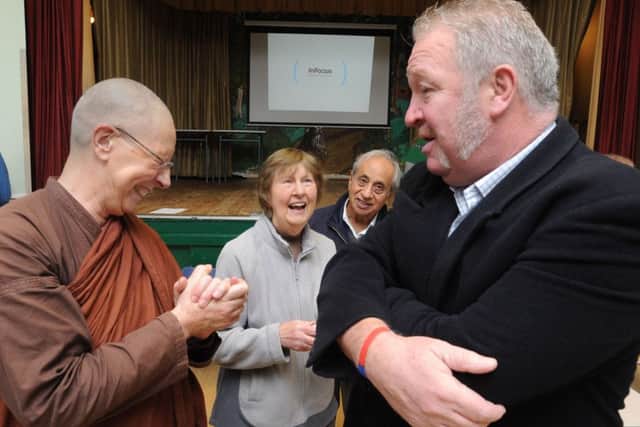 Representatives of many faiths gathered at Adeyfield Community Centre on Sunday. MP Mike Penning chatting with Ajahn Sundara of the Great Gaddesden Bhuddist temple