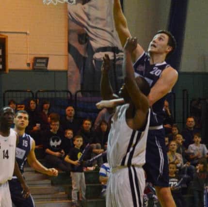 Storm's Michael Darlow rises above the defence to tip in two of his 22 points against Newham Neptunes PNL-140112-102858002