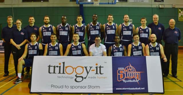 Phil Macleod (front row, fourth from left), with the Storm senior squad players, coaches and physio.