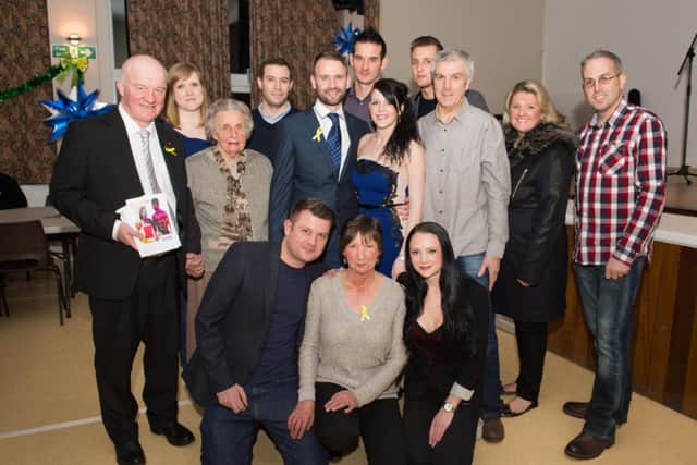 Surprise party for Emily Icke, one year after her double lung transplant, held at Pitstone Memorial Hall - Emily is pictured centre with partner David and family members