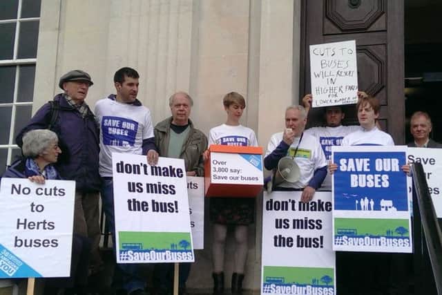 Protest against bus cuts outside County Hall