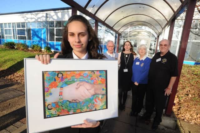 Jessica Rizova of Astley Cooper School won a prize and cheque from Hemel Hempstead Lions for her poster