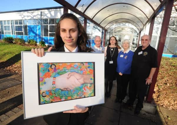 Jessica Rizova of Astley Cooper School won a prize and cheque from Hemel Hempstead Lions for her poster