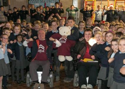 Michael McGrath (in red) and sports apprentice Jack Morrell at Bishop Wood School in Tring