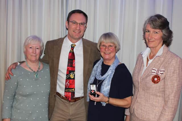 Dave Perrottet's wife Liz and son James Northway, with his former wife Harriet, receive a donor award in his honour from the Deputy Lord Lieutenant of Hertfordshire PNL-141230-122042001